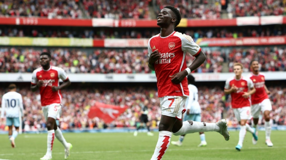 Arsenal survive Forest scare to make winning Premier League start
