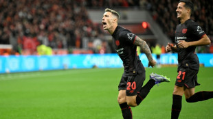 New coach sees nine-man Leverkusen beat Frankfurt