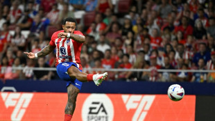 Atletico hit three to take early Liga lead