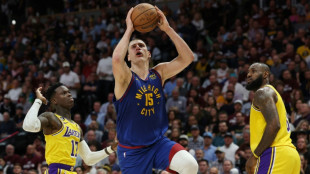 Jokic dominates as Nuggets hold off Lakers in opener
