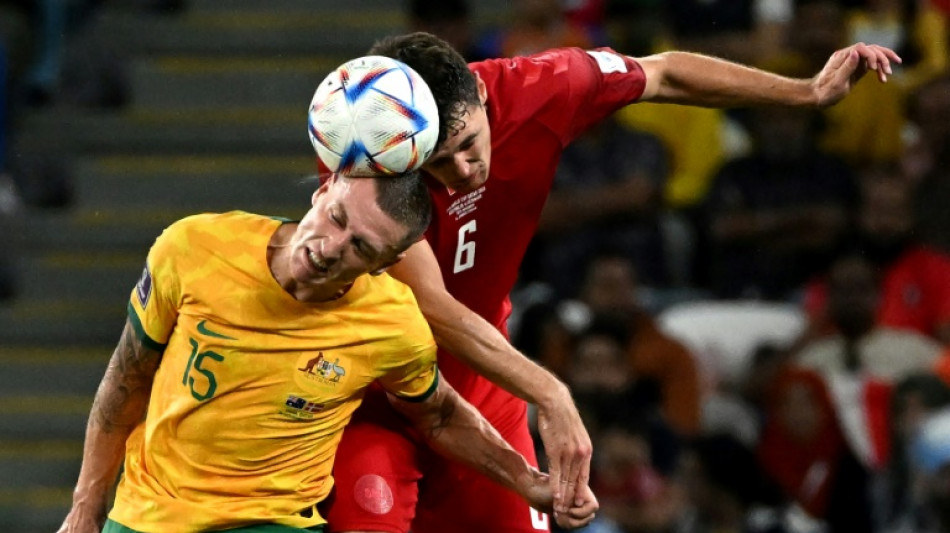 Australia reach World Cup last 16 and send Denmark home