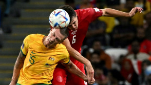 Australia reach World Cup last 16 and send Denmark home