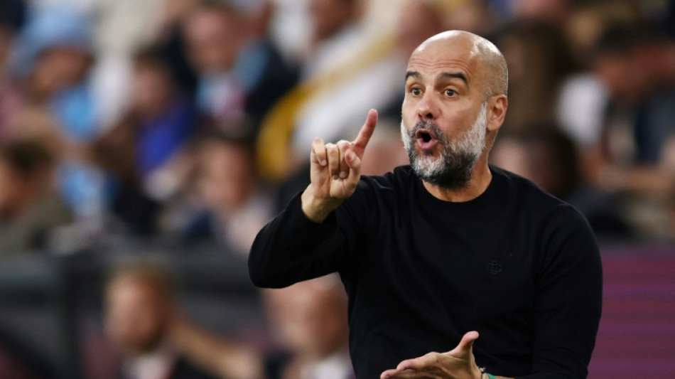Man City manager Guardiola to miss two matches after back surgery