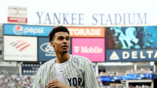 Likely NBA top pick Wembanyama throws baseball with Yankees
