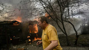 Russian shells turn homes to ash on Kyiv front