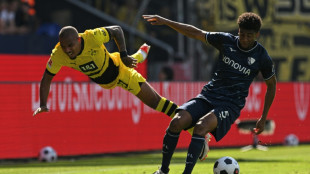 Malen rescues point for disappointing Dortmund at Bochum