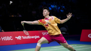 Thailand's Kunlavut spills blood to win badminton world crown