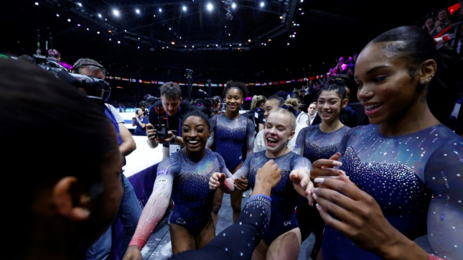 Biles wins 20th world title as US women seal team gold