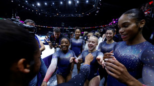 Biles wins 20th world title as US women seal team gold