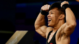 Strong-arm tactics lift Indonesia's Abdullah to gold and world record