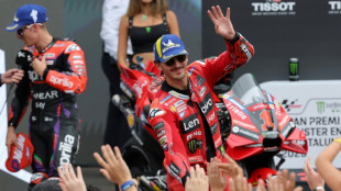 Bagnaia overcomes horror crash to defend MotoGP lead on home turf