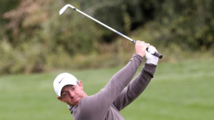 Bland shares Dubai lead as McIlroy heads for driving range