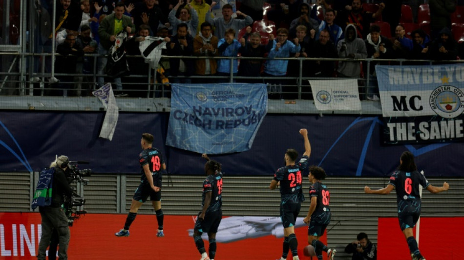 Alvarez and Doku strike late to push Man City past Leipzig
