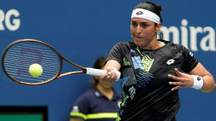 Ailing Jabeur battles into US Open second round