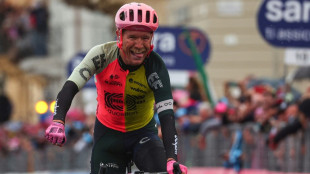 Denmark's Cort escapes to victory as Giro resumes in the rain