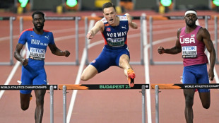 Norway's Karsten Warholm wins third world 400m hurdles title