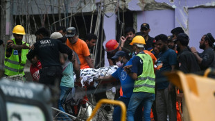 Search continues after Pakistan building collapse kills 14