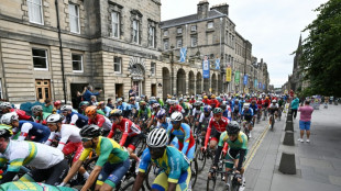 Five arrested as protest halts road race at cycling worlds