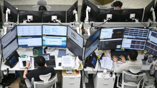 World stocks mostly lower as markets await Fed decision