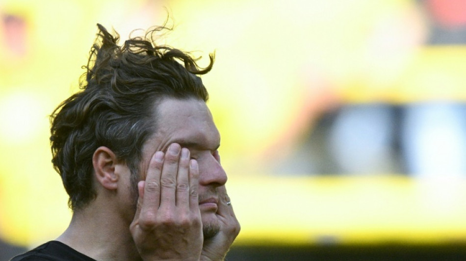 Dortmund face 'brutal' reality as title dream vanishes