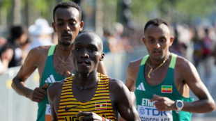 Uganda's Kiplangat wins men's world marathon title