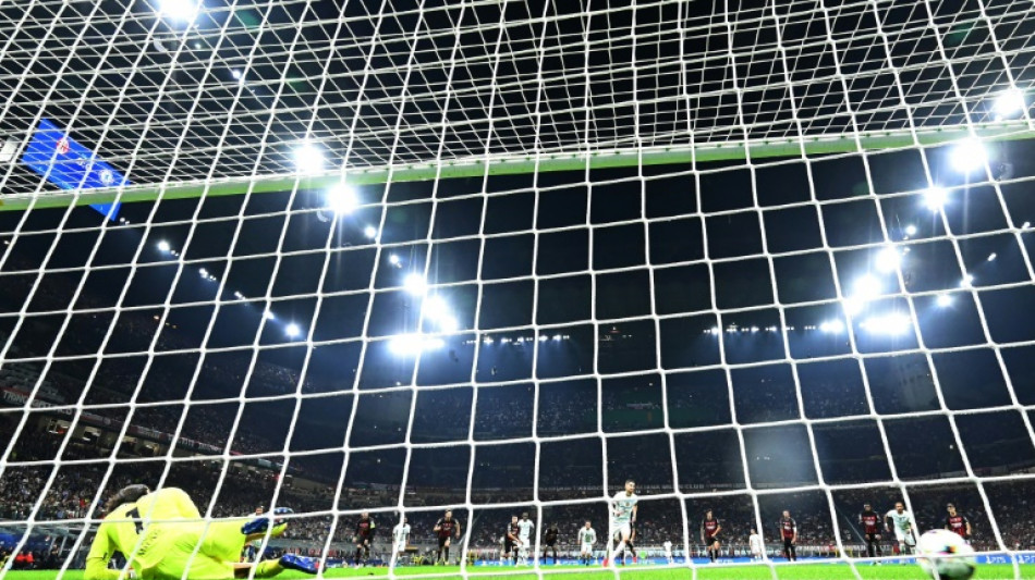 Chelsea beat 10-man Milan to top Champions League Group E