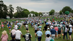 Masters play resumes after brief suspension for bad weather