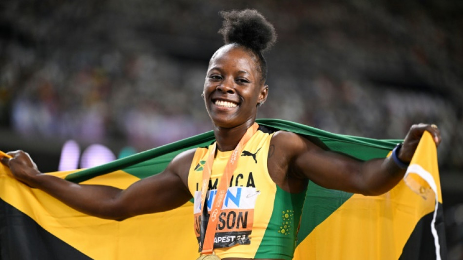 Jackson retains women's 200m world title with stunning run