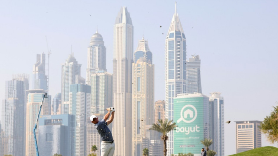 McIlroy comes through 'battle' to edge bitter rival Reed in Dubai