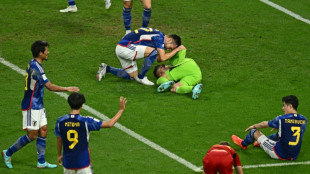 Japan stun Spain but both reach World Cup last 16