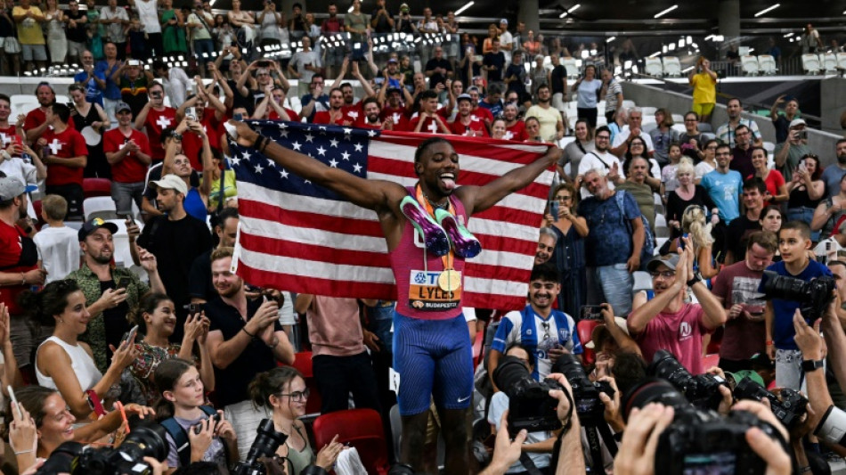 Lyles wins third 200m title for rare world sprint double