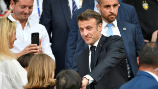 Lager than life: Macron downs a beer to cheers, and criticism