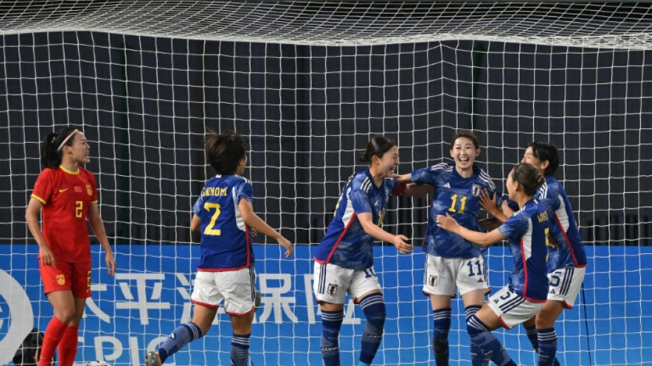 Japan set up North Korea showdown, runner wins again after ban