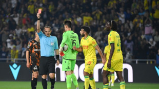 Marseille squander lead in draw with 10-man Nantes