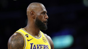 James breaks NBA appearance record as Lakers win thriller 