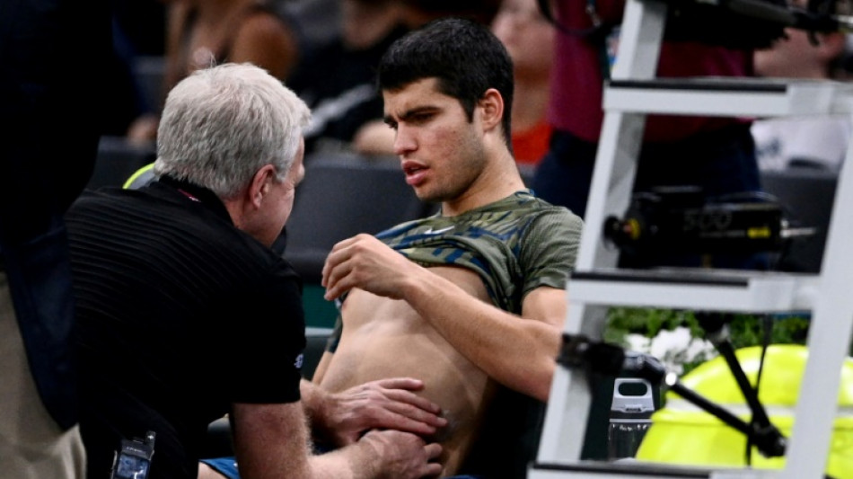 Alcaraz retires with injury as Djokovic races into semi-finals