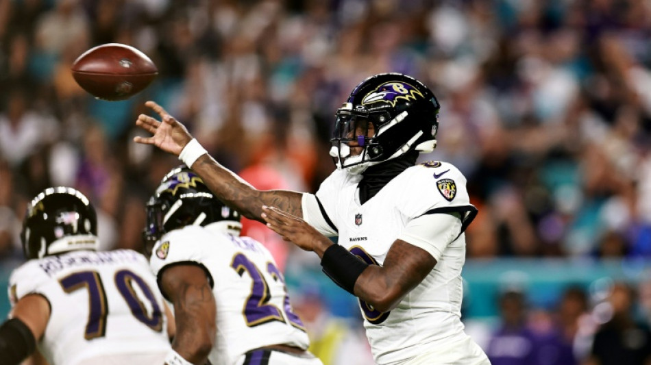 Jackson throws four TD passes as Ravens rout Dolphins