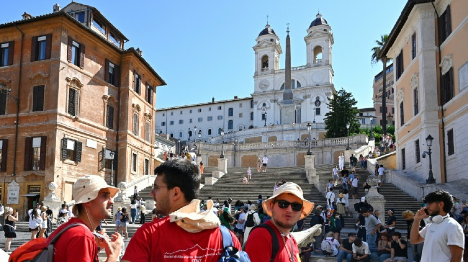 At open-air Church party, many thousands of young Catholics eagerly await pope