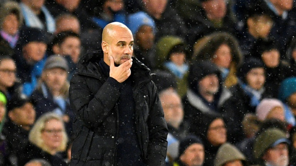 Guardiola says Man City will struggle to catch leaders Arsenal