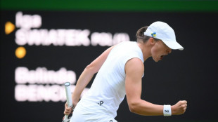 Swiatek saves two match points to reach Wimbledon quarters