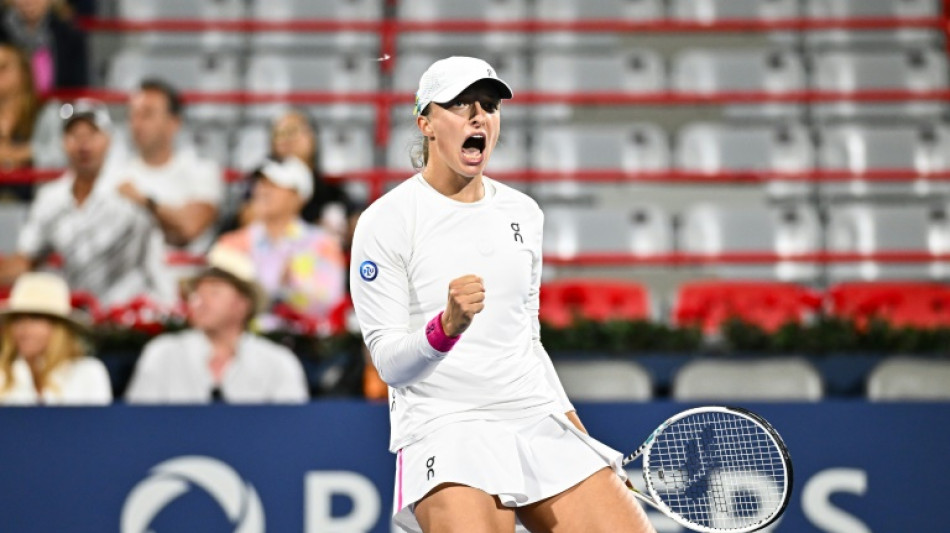Swiatek holds off Collins to line up Montreal semi-final with Pegula