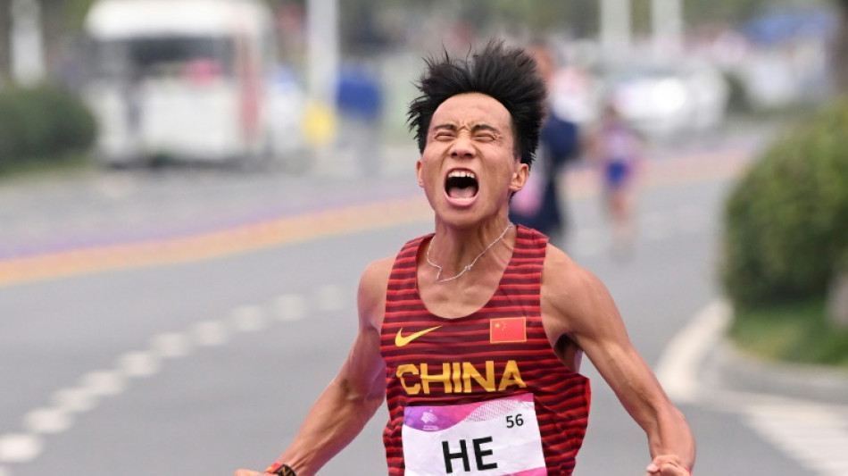 China's He wins Asian Games marathon, Chuma claims women's gold