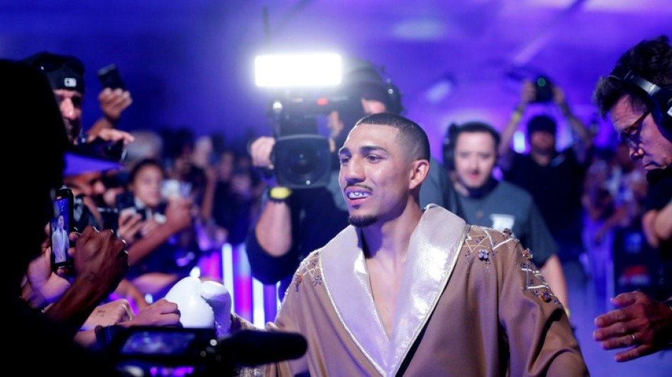 Lopez downs previously unbeaten Taylor to win light-welter title