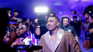 Lopez downs previously unbeaten Taylor to win light-welter title