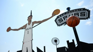 Giant cut-out, prayer candles as 'Wemby-mania' grips San Antonio