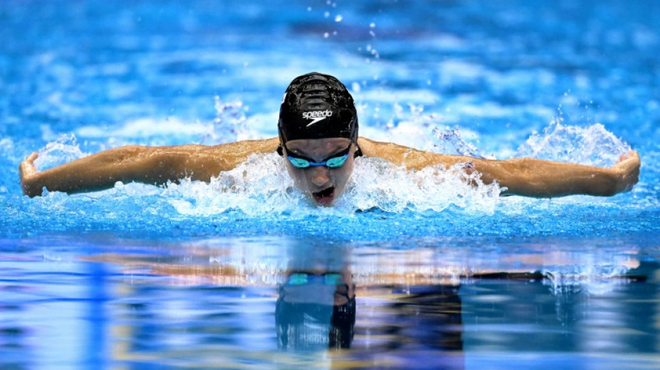 Americans finish with flourish as Canadian McIntosh wins second swimming gold