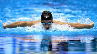 Americans finish with flourish as Canadian McIntosh wins second swimming gold