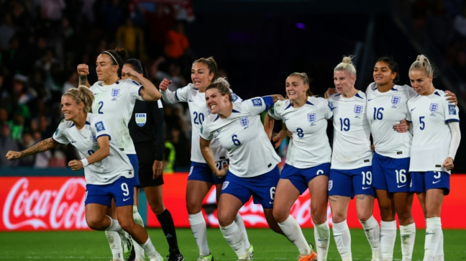 Ten-player England scrape through as Nigeria pay World Cup penalty
