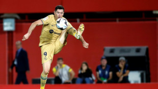 Barca edge Mallorca to top league, Atletico dominate sorry Sevilla