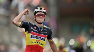 Evenepoel powers to Vuelta stage three win and takes red jersey